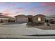 Charming single-story home boasts desert landscaping, a two-car garage, and an inviting front porch at 1101 W Oleander Ave, Queen Creek, AZ 85140