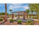Relax at this covered outdoor picnic area, featuring a grill, concrete tables, and beautiful landscaping at 1101 W Oleander Ave, Queen Creek, AZ 85140