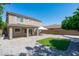 Spacious backyard with a covered patio, a gazebo and artifical turf for outdoor enjoyment at 12546 N 142Nd Ln, Surprise, AZ 85379