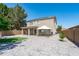 Large backyard featuring a covered patio, gazebo, manicured lawn, and mature trees at 12546 N 142Nd Ln, Surprise, AZ 85379