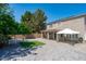 Spacious backyard with a covered patio, gazebo, artificial turf, and manicured landscaping at 12546 N 142Nd Ln, Surprise, AZ 85379
