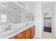 Bathroom featuring tile floors, cherry-wood cabinets, double sinks, and recessed lighting at 12546 N 142Nd Ln, Surprise, AZ 85379