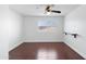 Bedroom with laminate floors, built-in shelf, and shuttered window at 12546 N 142Nd Ln, Surprise, AZ 85379