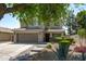 Beautiful two-story home boasting a lush front yard, complemented by a well-manicured lawn and a spacious two-car garage at 12546 N 142Nd Ln, Surprise, AZ 85379