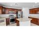 Beautiful kitchen offers stainless steel appliances and granite countertops at 12546 N 142Nd Ln, Surprise, AZ 85379
