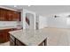 The kitchen features stainless steel appliances, granite countertops and island at 12546 N 142Nd Ln, Surprise, AZ 85379