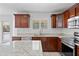This kitchen features stainless steel appliances, granite countertops and island at 12546 N 142Nd Ln, Surprise, AZ 85379
