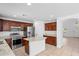 Gourmet kitchen features stainless steel appliances, granite countertops and island at 12546 N 142Nd Ln, Surprise, AZ 85379