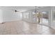 This living room features tile floors, natural light, and a modern ceiling fan at 12546 N 142Nd Ln, Surprise, AZ 85379