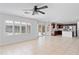 Open-concept living room featuring tile flooring and ample natural light at 12546 N 142Nd Ln, Surprise, AZ 85379