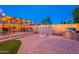 Outdoor space with pergola and outdoor kitchen area with grill and fire pit for entertaining at 13318 W Indianola Ave, Litchfield Park, AZ 85340