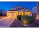 Well-maintained home with inviting curb appeal, featuring a two-car garage and manicured landscaping at 13318 W Indianola Ave, Litchfield Park, AZ 85340
