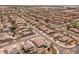 A bird's eye view of the property showcasing its backyard and position within a tranquil residential area at 1415 N Frederick Ln, Casa Grande, AZ 85122