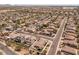 An elevated view displaying the home's location in a friendly neighborhood with solar panels at 1415 N Frederick Ln, Casa Grande, AZ 85122
