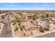This aerial view shows the property with a tile roof in a well-maintained neighborhood at 1415 N Frederick Ln, Casa Grande, AZ 85122