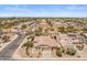 This aerial view showcases the property with a tile roof in a well-maintained neighborhood at 1415 N Frederick Ln, Casa Grande, AZ 85122