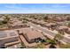This aerial view showcases the home's backyard with gazebo and solar panels in the community at 1415 N Frederick Ln, Casa Grande, AZ 85122