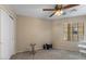 Well-lit bedroom features neutral walls, carpeted floors, and a ceiling fan at 1415 N Frederick Ln, Casa Grande, AZ 85122
