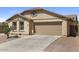 Welcoming single-story home featuring desert landscaping, neutral colors, and a two-car garage at 1415 N Frederick Ln, Casa Grande, AZ 85122