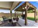 Outdoor seating area with view of backyard with grill at 1415 N Frederick Ln, Casa Grande, AZ 85122