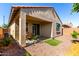 Inviting backyard with covered patio, desert landscaping, and low-maintenance design at 14233 W Georgia Dr, Surprise, AZ 85379