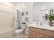 Bright bathroom featuring a tub/shower combo, white vanity, and nautical decor at 14233 W Georgia Dr, Surprise, AZ 85379