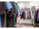 Walk-in closet with organized storage racks and hanging space; offers ample room for clothes and shoes at 14233 W Georgia Dr, Surprise, AZ 85379