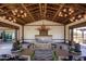 Community room showcasing a fireplace, seating areas, decorative lighting, and tables at 14233 W Georgia Dr, Surprise, AZ 85379