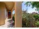 Inviting covered front porch featuring desert landscaping, a welcoming front door, and ample shade at 14233 W Georgia Dr, Surprise, AZ 85379