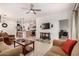 Spacious living area with tile floors and an open layout, blending seamlessly with the kitchen at 14233 W Georgia Dr, Surprise, AZ 85379