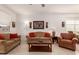 Open living room showcasing neutral tones, comfortable seating, and stylish decor at 14233 W Georgia Dr, Surprise, AZ 85379