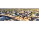 Expansive aerial view of a well-planned community showcasing many single-Gathering homes with manicured lawns and tree-lined streets at 14821 N 62Nd Ave, Glendale, AZ 85306