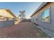 Large, low-maintenance backyard area with gravel and block fence at 14821 N 62Nd Ave, Glendale, AZ 85306