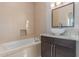 Modern bathroom featuring a vessel sink, granite countertop, and neutral tiled shower and tub combination at 14821 N 62Nd Ave, Glendale, AZ 85306
