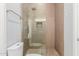 Sleek walk-in shower with rainfall showerhead and modern tile finishes at 14821 N 62Nd Ave, Glendale, AZ 85306