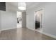Bright bedroom showcasing wood-look floors and views into the kitchen and bathroom at 14821 N 62Nd Ave, Glendale, AZ 85306