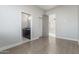 Wood-look floors connect the spacious bedroom to the luxurious bathroom at 14821 N 62Nd Ave, Glendale, AZ 85306