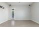 This bedroom features neutral walls, hardwood floors, speakers on the ceiling, and a door to the exterior at 14821 N 62Nd Ave, Glendale, AZ 85306