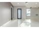 Bright entryway featuring tile flooring, gray walls, and a modern front door at 14821 N 62Nd Ave, Glendale, AZ 85306