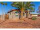 Side view of a home featuring xeriscape landscaping, a new fence, and a tidy, modern exterior at 14821 N 62Nd Ave, Glendale, AZ 85306