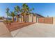 Corner lot property with desert landscaping, private drive, and a gated carport at 14821 N 62Nd Ave, Glendale, AZ 85306
