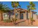 Inviting home exterior with drought-resistant landscaping, a well-lit entrance, and a secure gate at 14821 N 62Nd Ave, Glendale, AZ 85306