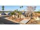 Inviting home boasts desert landscaping, mature palms, solar panels, and a spacious driveway at 14821 N 62Nd Ave, Glendale, AZ 85306