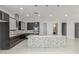 Contemporary kitchen with large center island, mosaic backsplash, and modern appliances at 14821 N 62Nd Ave, Glendale, AZ 85306