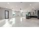 Expansive living area showcasing a large kitchen with modern appliances and sleek finishes at 14821 N 62Nd Ave, Glendale, AZ 85306