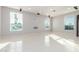 Large living room with tile flooring, track lighting, and multiple windows at 14821 N 62Nd Ave, Glendale, AZ 85306