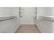 Spacious walk-in closet with custom shelving and rods offers ample storage space at 14821 N 62Nd Ave, Glendale, AZ 85306