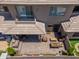Outdoor living space showing a covered patio, fireplace, dining space and seating area; lush landscaping adds charm at 15240 N Clubgate Dr # 160, Scottsdale, AZ 85254