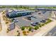 Aerial view of commercial property with a sports grill, sushi restaurant, and ample parking at 15240 N Clubgate Dr # 160, Scottsdale, AZ 85254