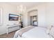 Bright bedroom features a chandelier and decorative furniture at 15240 N Clubgate Dr # 160, Scottsdale, AZ 85254